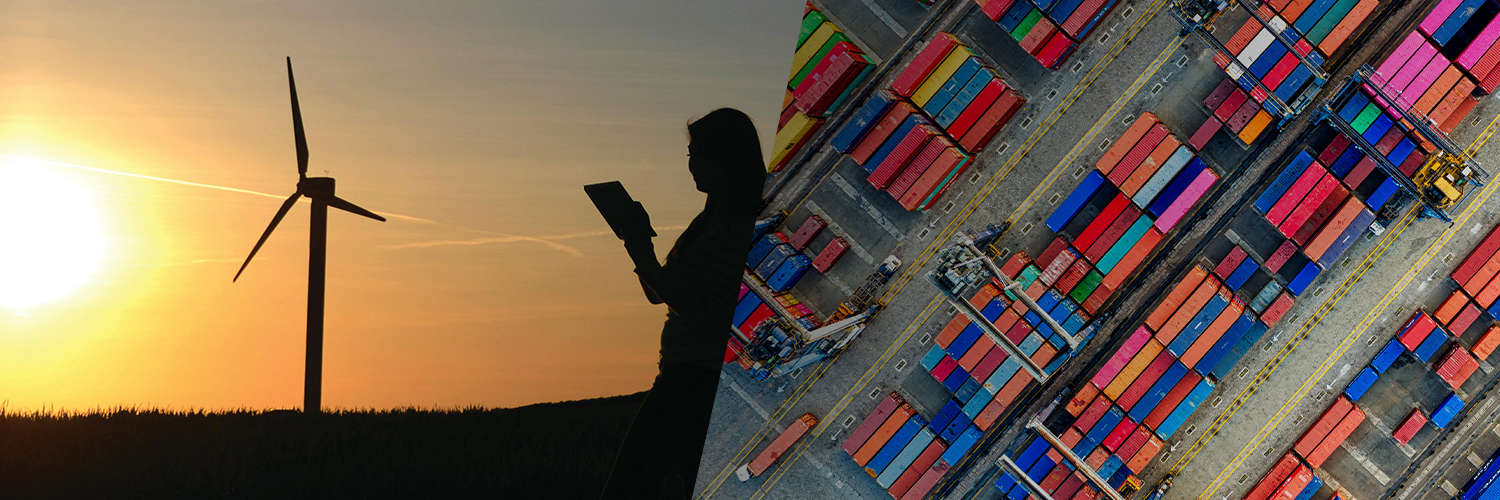 Woman looking at a wind turbine in sunset and shipping containers stacked together